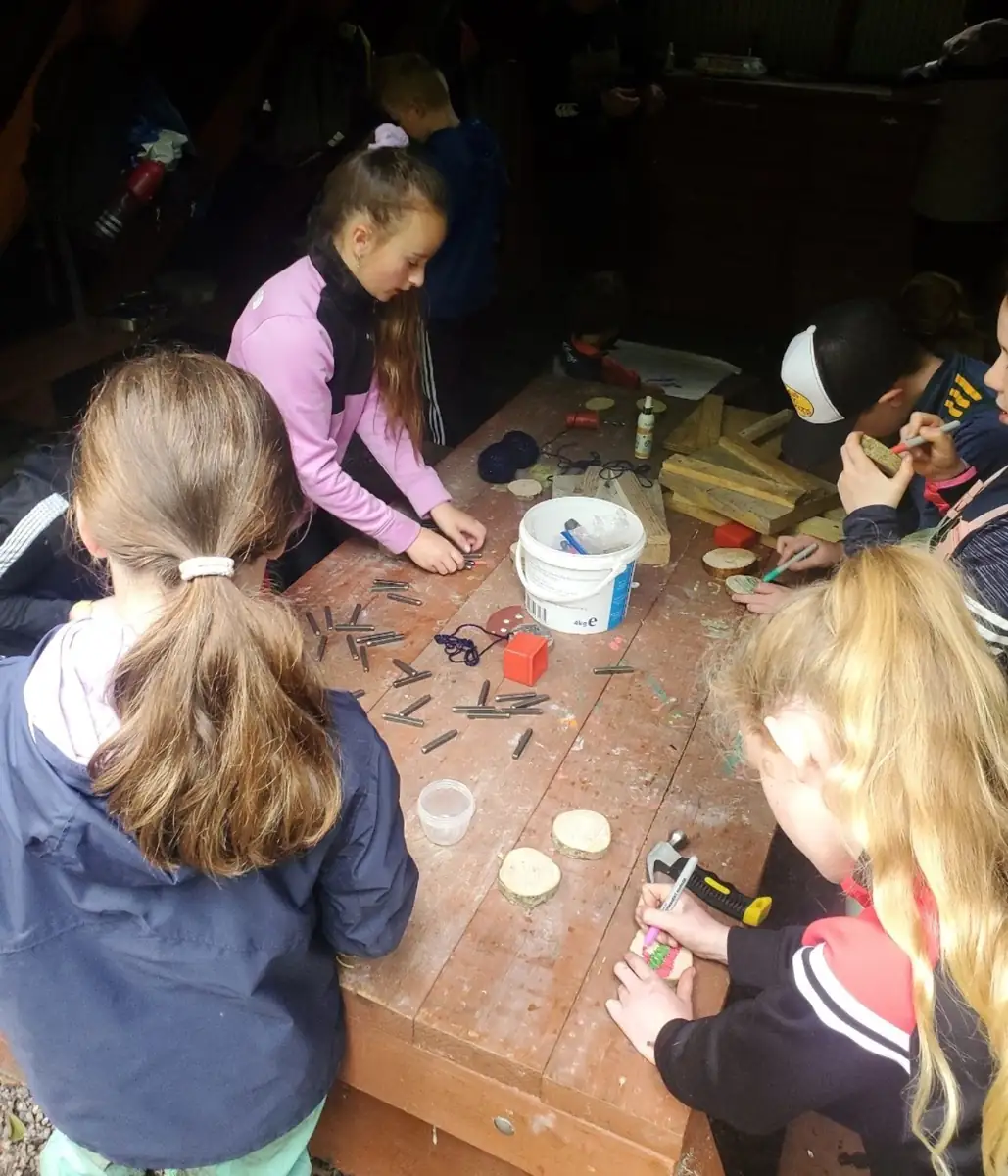 Children enjoying Forest School in the woodland