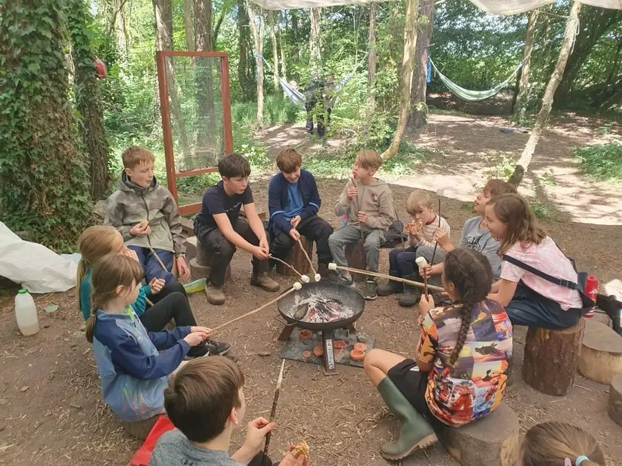 Children enjoying a Forest School campfire session
